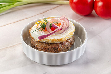Beefsteak chop with roasted egg