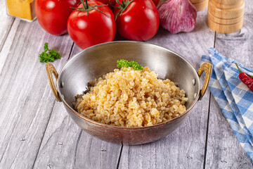 Vegan cuisine - boiled bulgur garnish