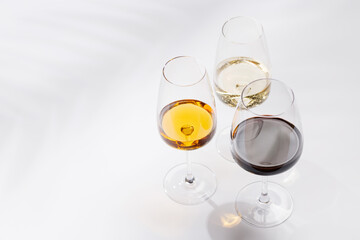 Naklejka premium Different wine glasses on white background