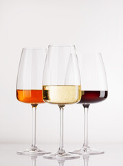 Naklejka premium Different wine glasses on white background