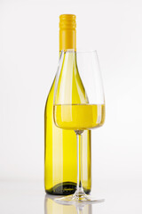 Naklejka premium White wine bottle and glass on white background