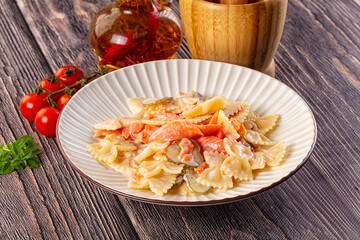 Italian pasta farfalle with salmon