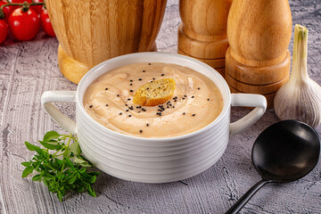 Tasty cheese cream soup with crouton