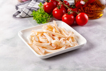 Canned marinated squid rings heap