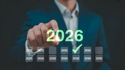 Businessman selecting year 2026 on digital futuristic timeline interface
