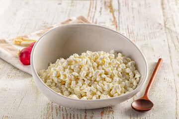 Grain cottage cheese in the bowl