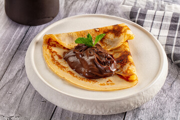 Sweet pancake with chocolate paste