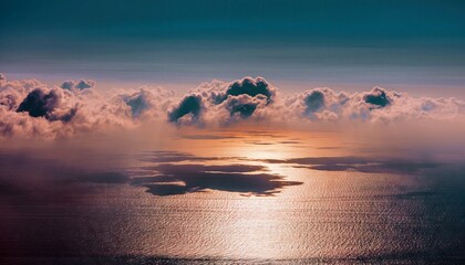 Aerial view of clouds and ocean at sunset, with a beautiful atmospheric mood.