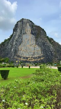 CHONBURI, Thailand - June 9, 2025: The Golden Buddha Mountain. The Buddha image carved into the rock of Khao Chi Chan, Khao Chion, Pattaya, engraved in gold,on a hill dedicated to His Majesty the King