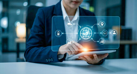 Business professional interacting with a futuristic holographic interface displaying digital data and icons