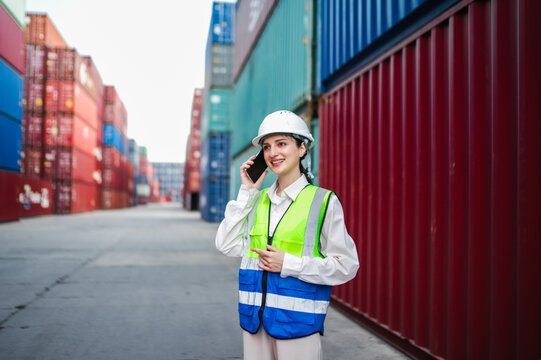 A female supervisor explains container routing details over the phone, working proactively to reduce delays and improve supply chain efficiency.
