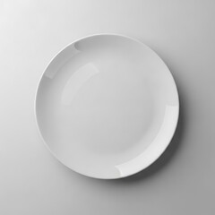 Clean white ceramic dinner plate on a light gray background