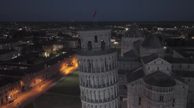 Cinematic sunrise drone footage of the Leaning Tower of Pisa and the Piazza dei Miracoli, captured with smooth aerial movements and soft early morning light.