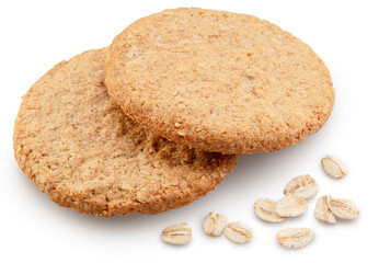 Oatсakes or oat biscuits and several rolled oats isolated on white background. File contains clipping paths.
