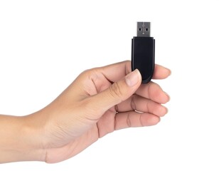 Female hand holding a USB flash drive isolated on a white background