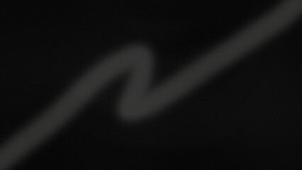 Abstract dark background with a blurred grey zigzag line