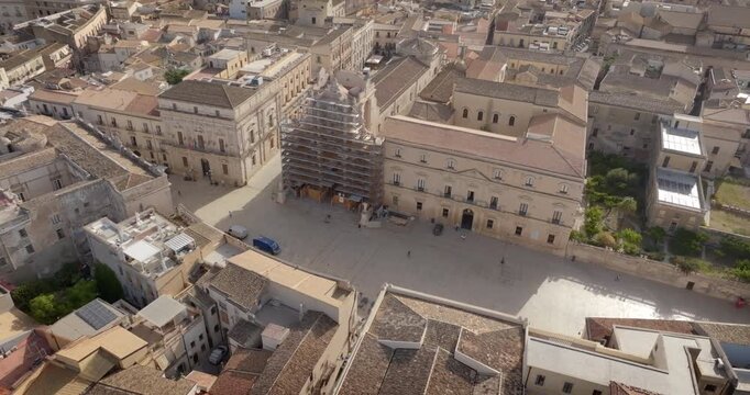 Aerial view of the Cathedral of Syracuse, formally Metropolitan Cathedral of the Nativity of the Blessed Virgin Mary. It's located in the center of the city, on the island of Ortygia, Sicily, Italy.