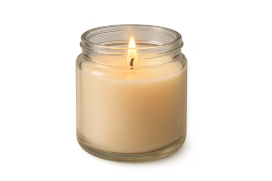 Lit beige candle in clear glass jar emits soft, warm glow
