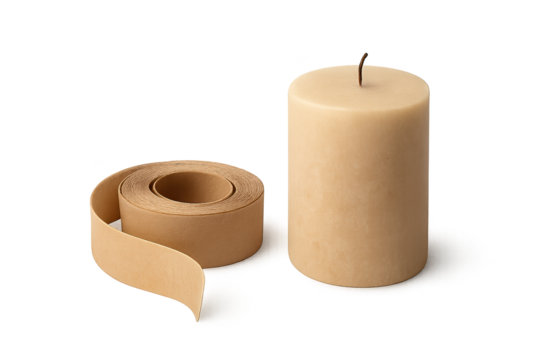 Beige pillar candle with wick beside roll of masking brown tape on clean transparent background