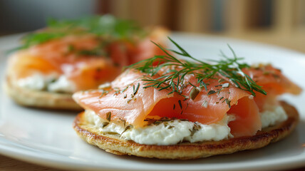 Smoked salmon on toast with creamy cheese and fresh dill creates delightful and elegant appetizer. dish is beautifully presented on white plate, highlighting its vibrant colors