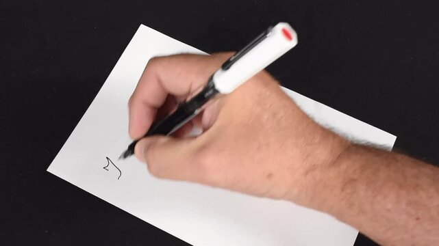 A 20 second video of someone writing a thank you note in cursive. - Powered by Adobe