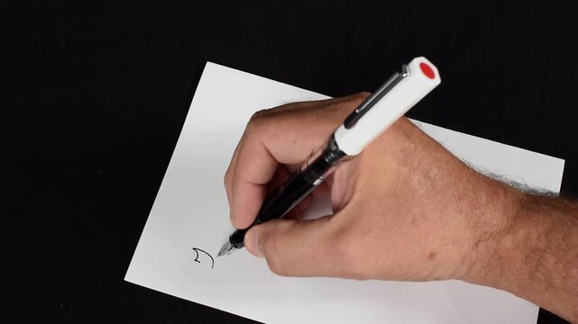 A 23 second video of someone writing a thank you note in cursive.