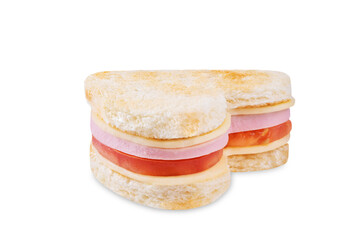 Ham tomato and cheese canape sandwiches in the form of heart for Valentine's day holidays on a white isolated background