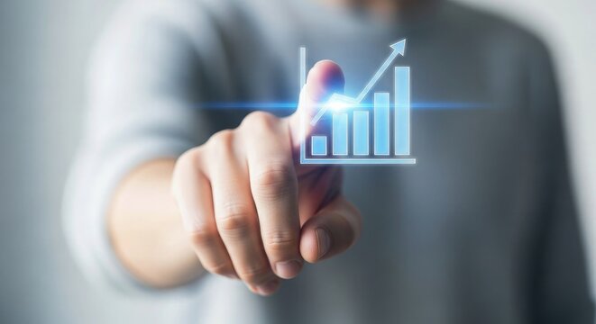 Man's finger pointing at glowing business growth chart