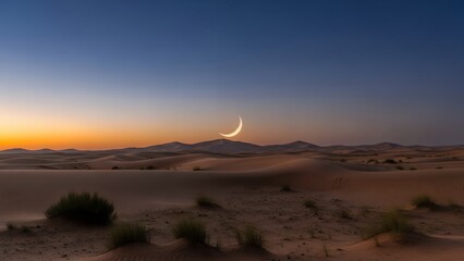 Crescent moon rises over desert landscape with sand dunes and sparse vegetation at sunset