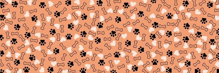 Fototapeta premium Light brown background with bone heart and cat paw prints, wide background