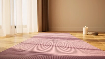 A rolled purple mat sits on wooden flooring, a lit candle and rock nearby