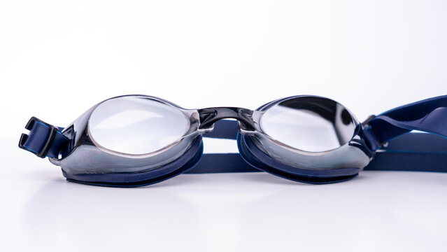Swimming goggles. Sports glasses for swimming in the pool against a white backdrop. High quality photo