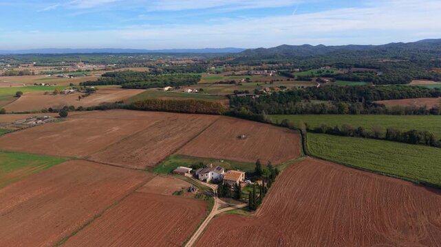 Aerial view of spanish farmhouse and plowed fields