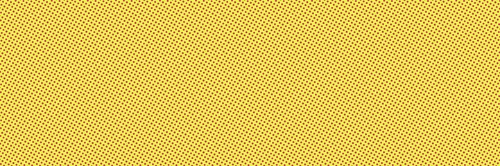 Yellow background with dark pink polka dot pattern, wide background