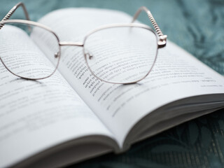 glasses on a book, learning and business © Mariusz