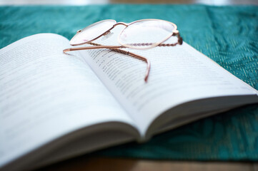 glasses on a book, learning and business © Mariusz