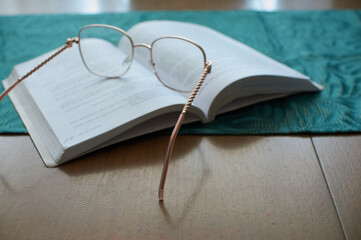 glasses on a book, learning and business © Mariusz