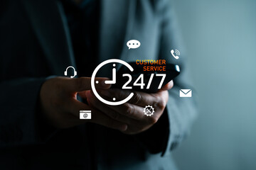 Businesswoman using smartphone with twenty four seven customer service icons, nonstop support, helpdesk, live chat, technical assistance, and online communication for client satisfaction.