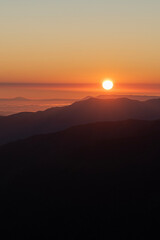 Fototapeta premium Watching the sunrise from the Kaçkar Mountains. Sunrise from Kaçkar Peak. Hiking towards Kaçkar Peak in the early morning. Magnificent view from Kaçkar Peak. Rize, Türkiye. 