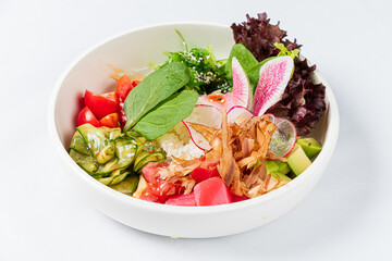 A vibrant mix of fresh vegetables, rice, and crunchy toppings create a delightful dish