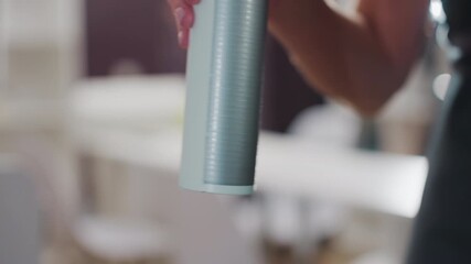 beauty product inspection, makeup expert carefully inspects cosmetic bottle with focus, skilled beauty professional closely evaluates cosmetic packaging with sharp attention to detail