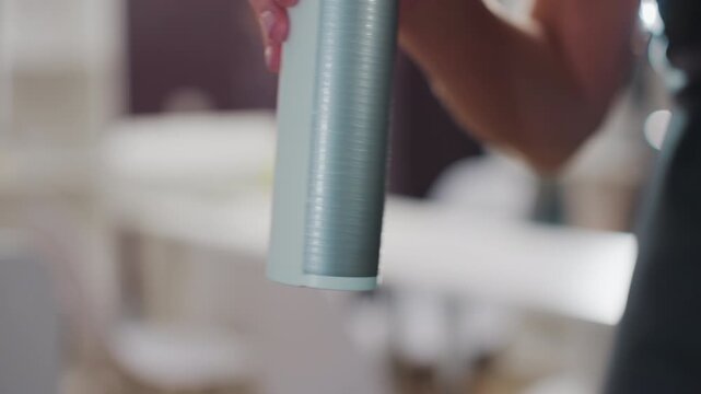 beauty product inspection, makeup expert carefully inspects cosmetic bottle with focus, skilled beauty professional closely evaluates cosmetic packaging with sharp attention to detail