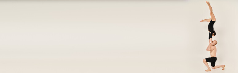 Dynamic duet of vivid acrobats showcasing strength and balance in a serene setting