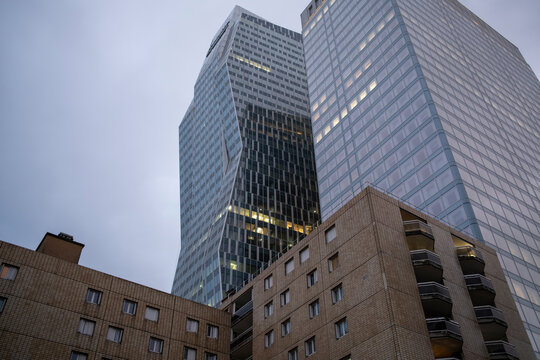 Skyscraper architecture interacts with residential and offices as contrast highlights every urban facade, illustrating the mixed use profile seen across Paris within La Defense