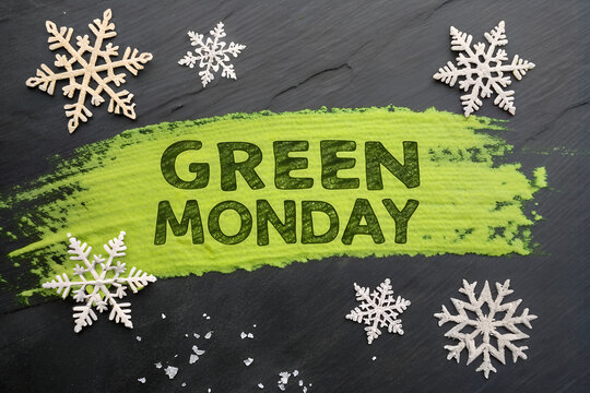Celebrate Green Monday with bold black text on a green paint streak, accented by white snowflakes. generative ai
