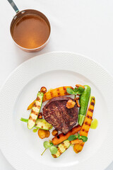 Deliciously grilled steak paired with fresh vegetables, creating a colorful and mouthwatering meal