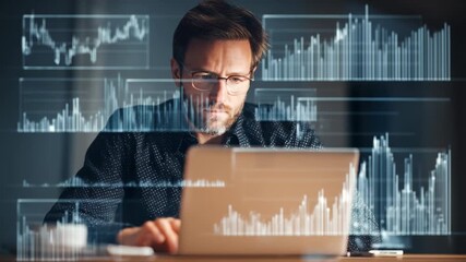 Focused man analyzing financial data on a laptop in a dimly lit room with digital graphs and charts displayed - Powered by Adobe