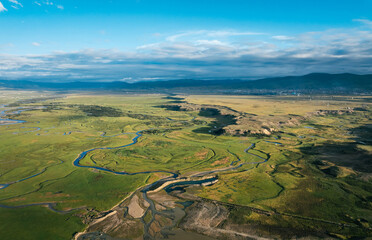 Beautiful curving rivers and green grassland in Litang county, China © lzf