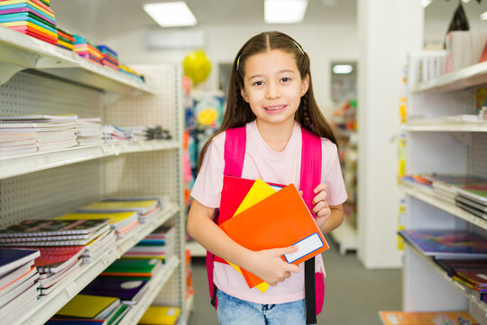 Little girl getting school supplies for back to school