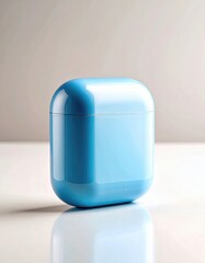 Seamless sky blue earbud case with a gleaming glossy finish and soft rounded contours, perfectly mirrored on white.